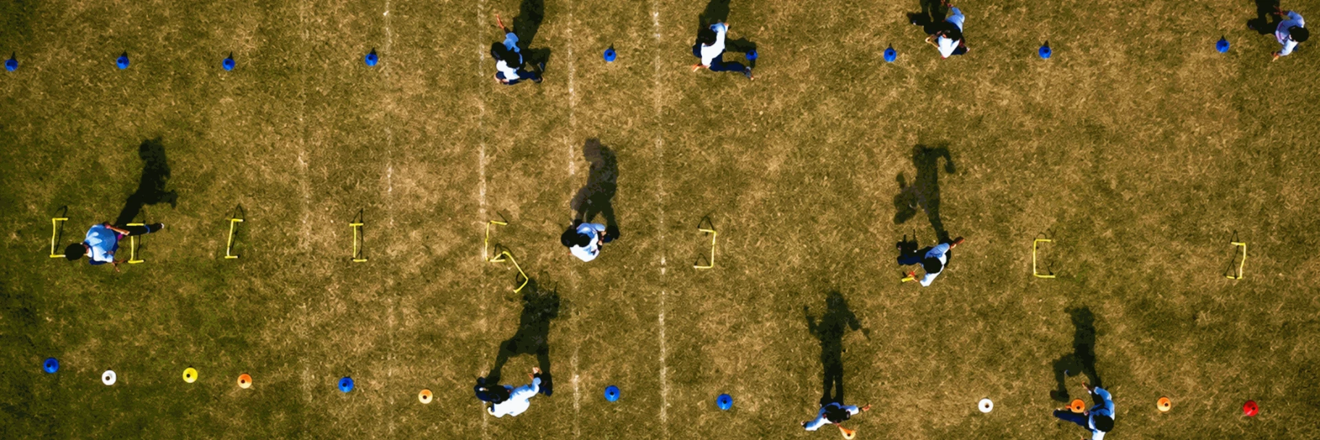 Aerial view of students training on the St. Teresa School sports ground